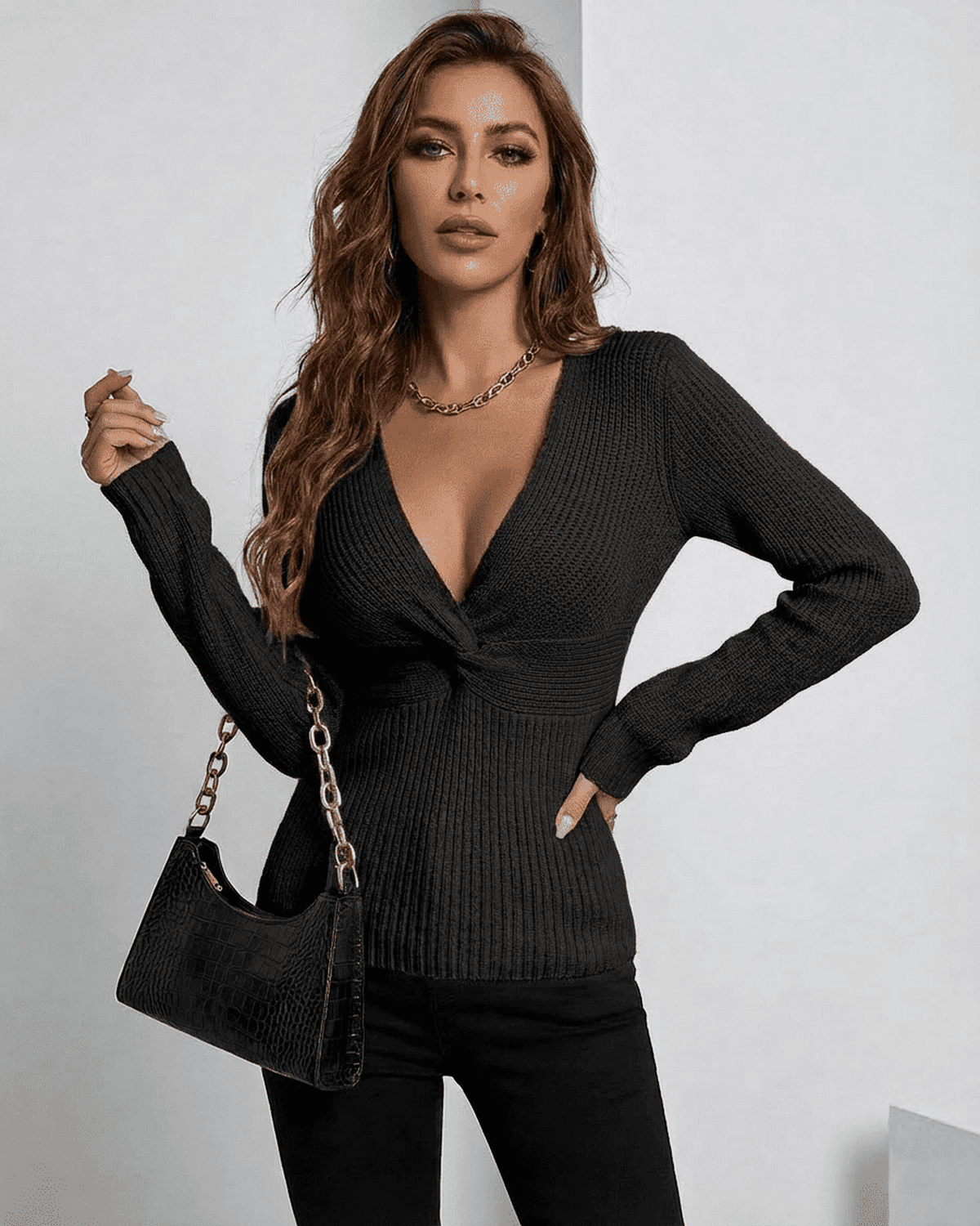 Model wearing Alina Pullover by SLIMONA, a sleek ribbed V-neck sweater in elegant black.