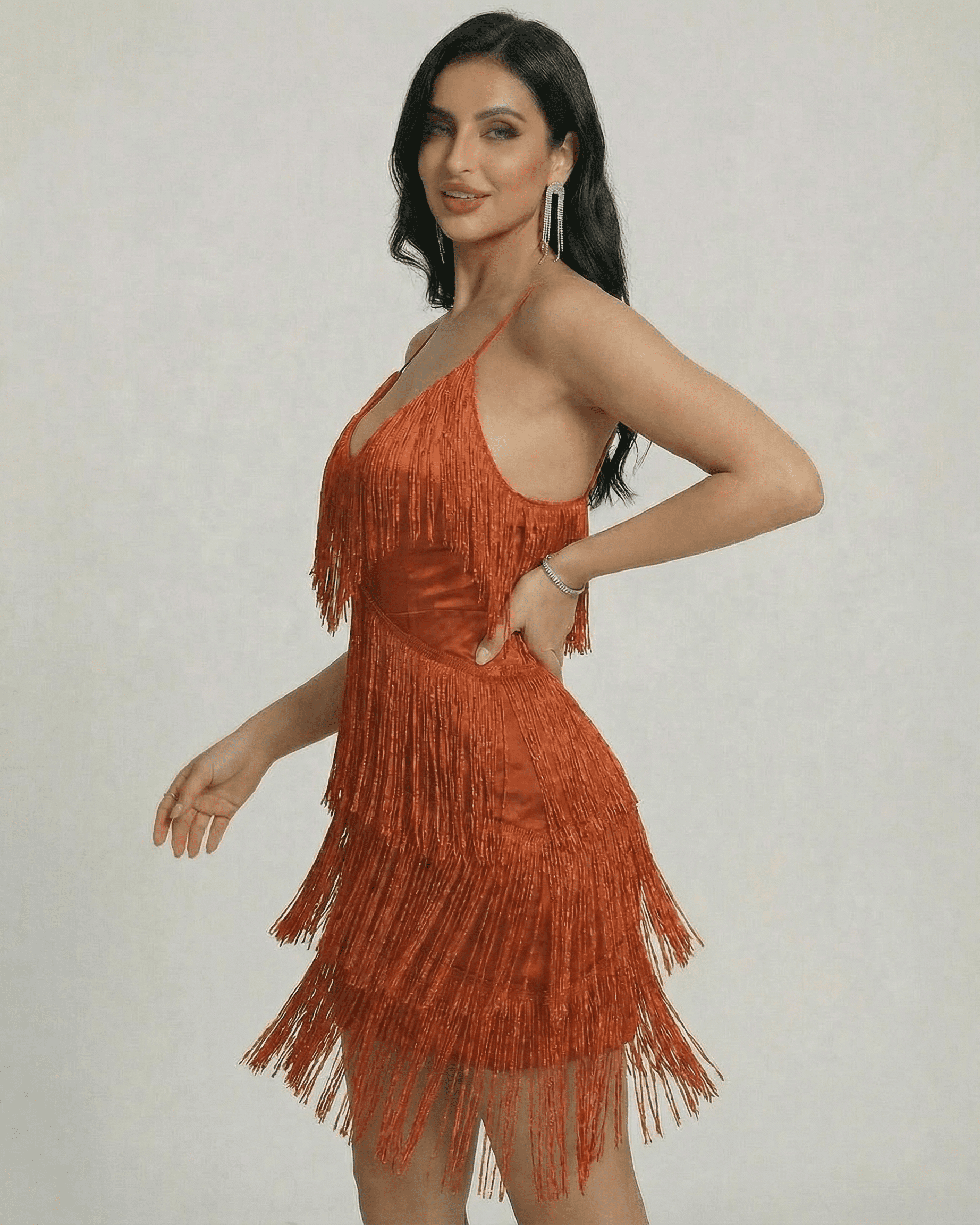 Amber Mini Dress by SLIMONA featuring layered fringe detailing and a sleek V-neck silhouette.