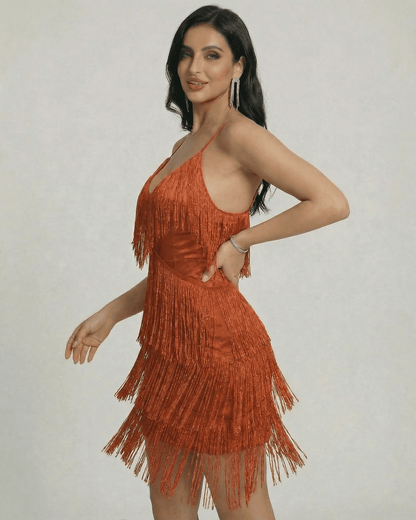 Amber Mini Dress by SLIMONA featuring layered fringe detailing and a sleek V-neck silhouette.