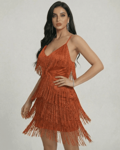 Amber Mini Dress by SLIMONA featuring layered fringe and a sleek V-neck design in warm amber tone.