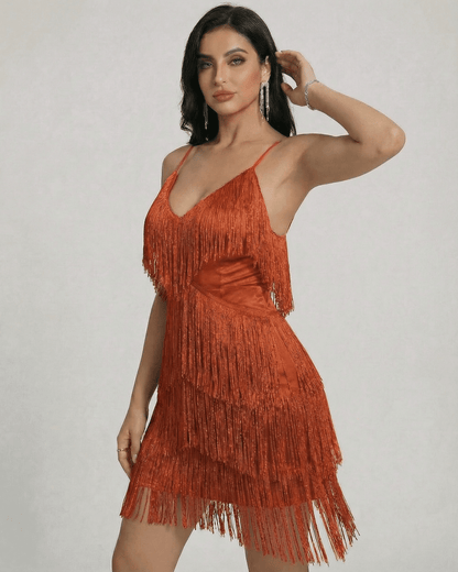 Amber Mini Dress by SLIMONA with layered fringe detail and a sleek V-neck silhouette in warm amber tone.
