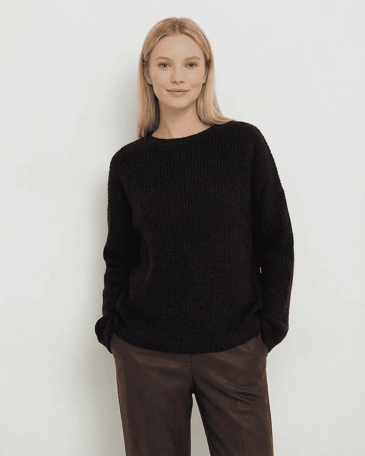 Arden Sweater by SLIMONA showcasing a loose fit ribbed knit in black, perfect for stylish warmth during cooler seasons.