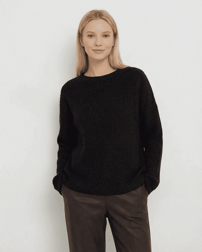 Arden Sweater by SLIMONA showcasing a loose fit ribbed knit in black, perfect for stylish warmth during cooler seasons.