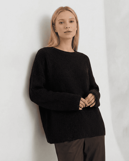 Arden Sweater by SLIMONA - Cozy loose fit ribbed knitwear in black with round neck and long sleeves.