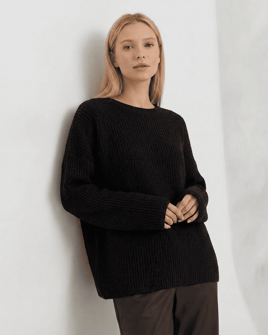Arden Sweater by SLIMONA - Cozy loose fit ribbed knitwear in black with round neck and long sleeves.