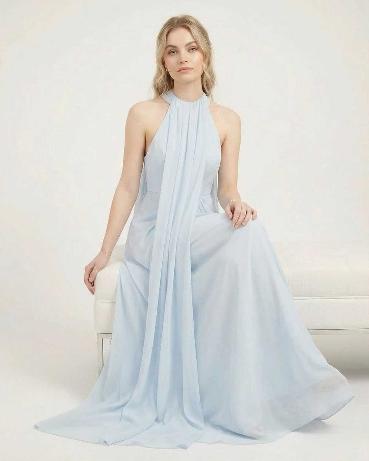 Aurelia Maxi Dress by SLIMONA in light blue, featuring a halter neck and flowing silhouette.