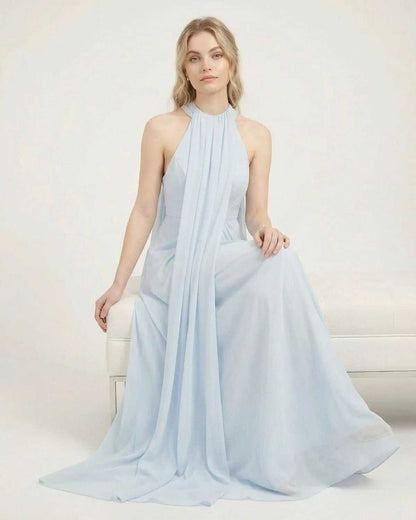 Aurelia Maxi Dress by SLIMONA in light blue, featuring a halter neck and flowing silhouette.