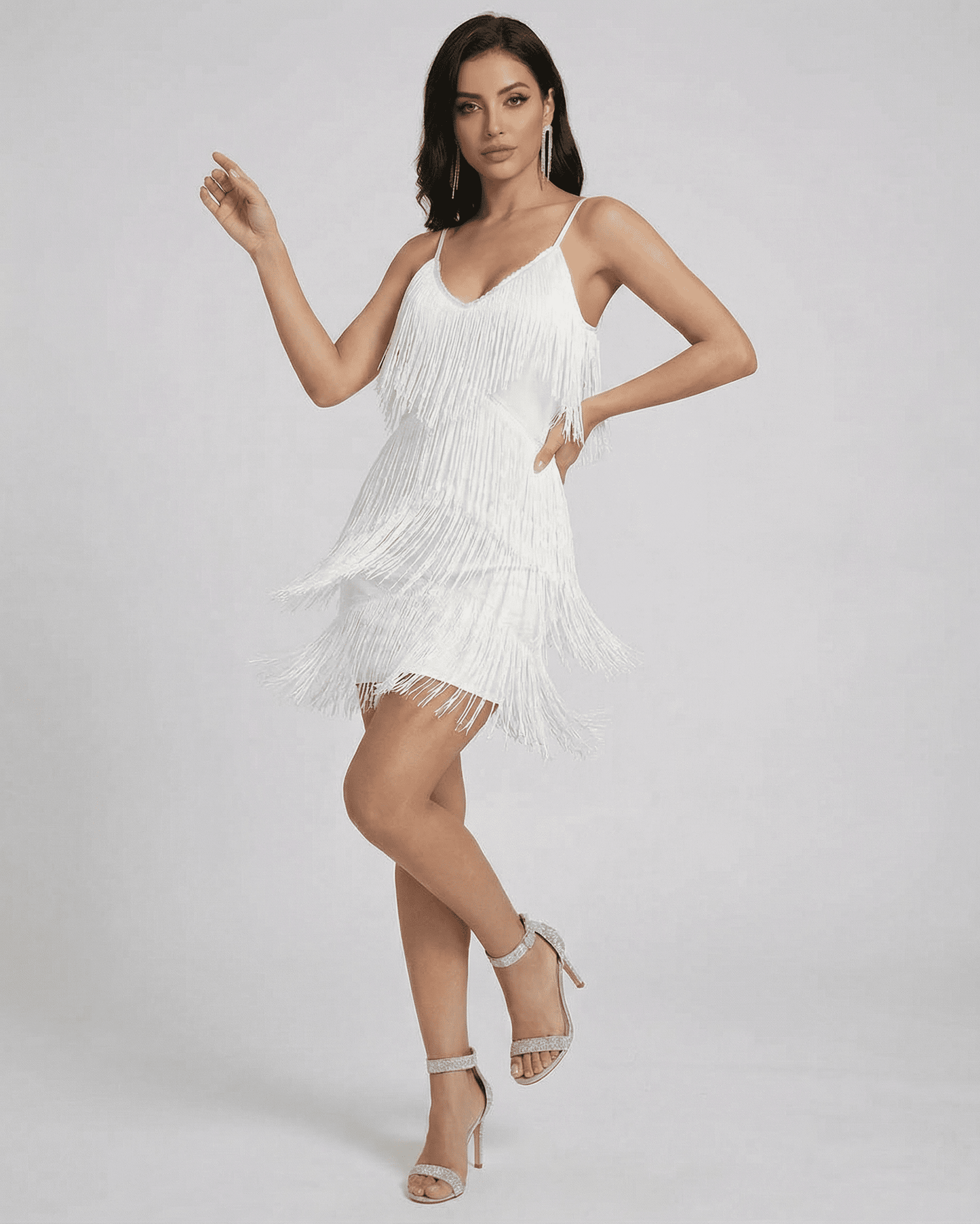 Aurora Mini Dress by SLIMONA featuring a fringe V-neck sleeveless design in white with elegant movement.