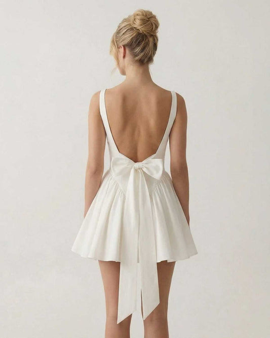 Aurora Mini Dress by SLIMONA - Square Neck Backless Mini Dress with Bow Detail in white, showcasing a chic A-line silhouette.