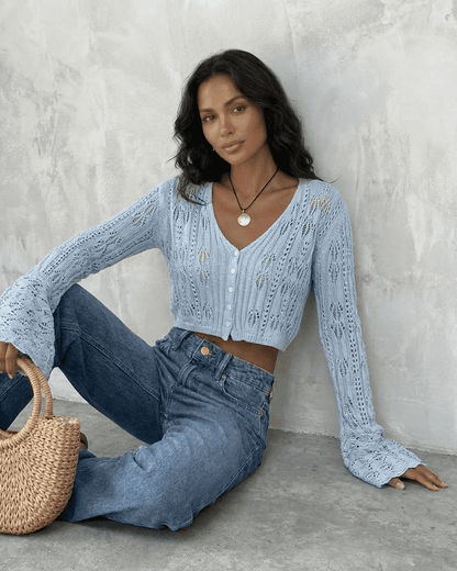 Azure Cardigan by SLIMONA, cropped cotton knit with flare sleeves styled with jeans and a basket.