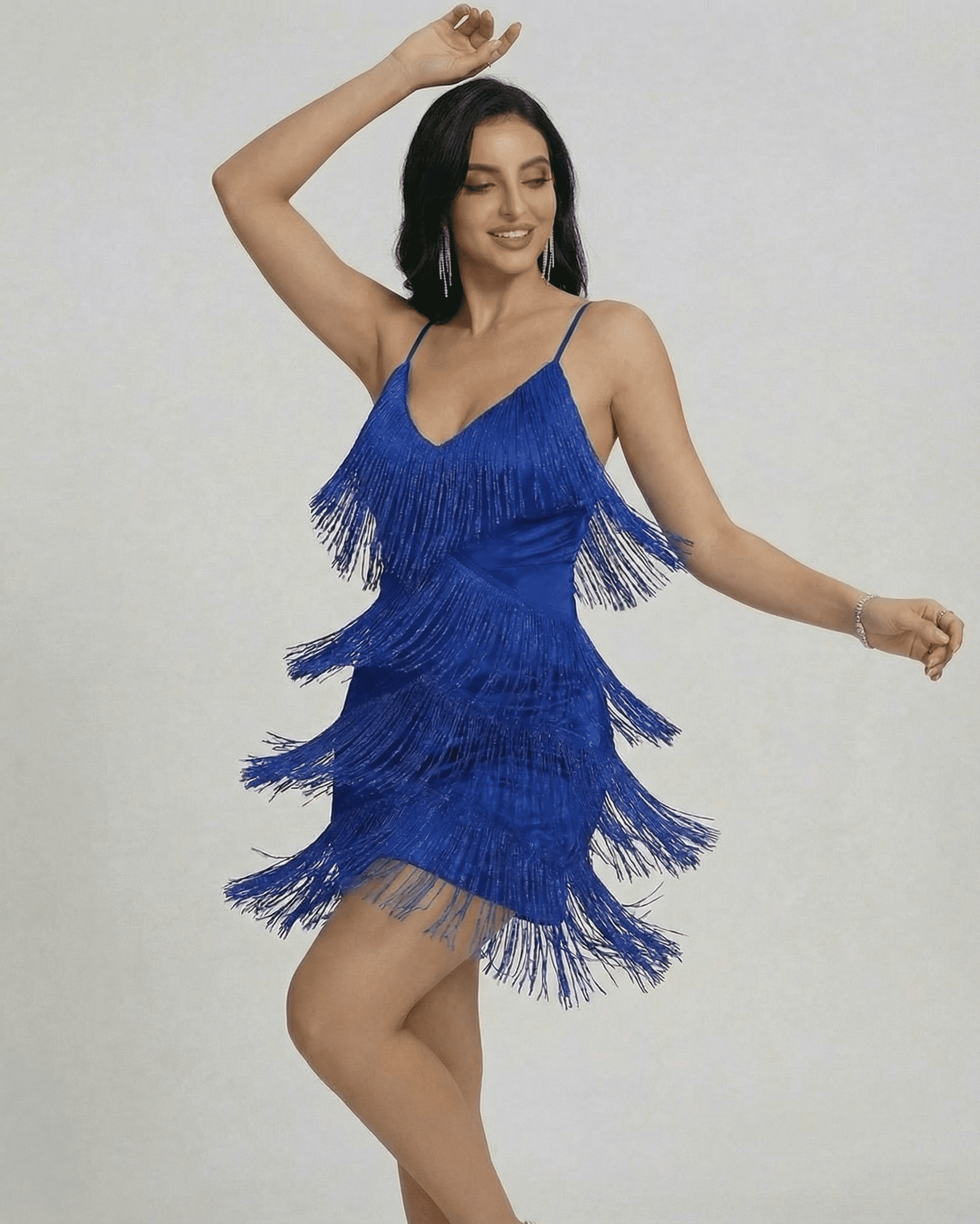 Azure Mini Dress by SLIMONA featuring a V-neck, fringe detailing, and a chic, sleeveless design.