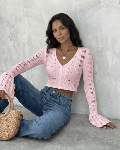 Blossom Cardigan in pink with flare sleeves, styled with jeans and a woven bag by SLIMONA.