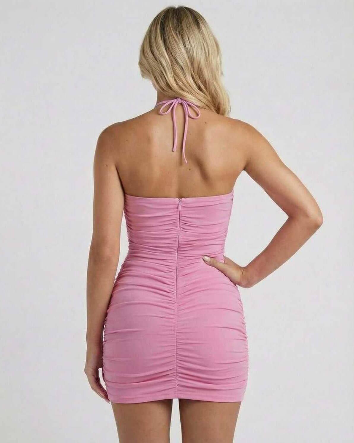 Back view of Blossom Mini Dress in pink ruched polyester-cotton blend by Lauven, showcasing halter neck and slim fit.