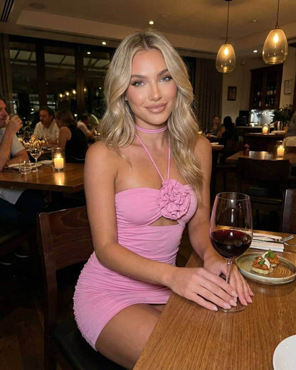 Lauven Blossom Mini Dress in pink, featuring a halter neck and ruched design, perfect for summer outings.
