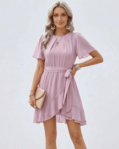 Blush Ruffle Dress by Lauven featuring flutter sleeves and a waist tie for elegant summer style.
