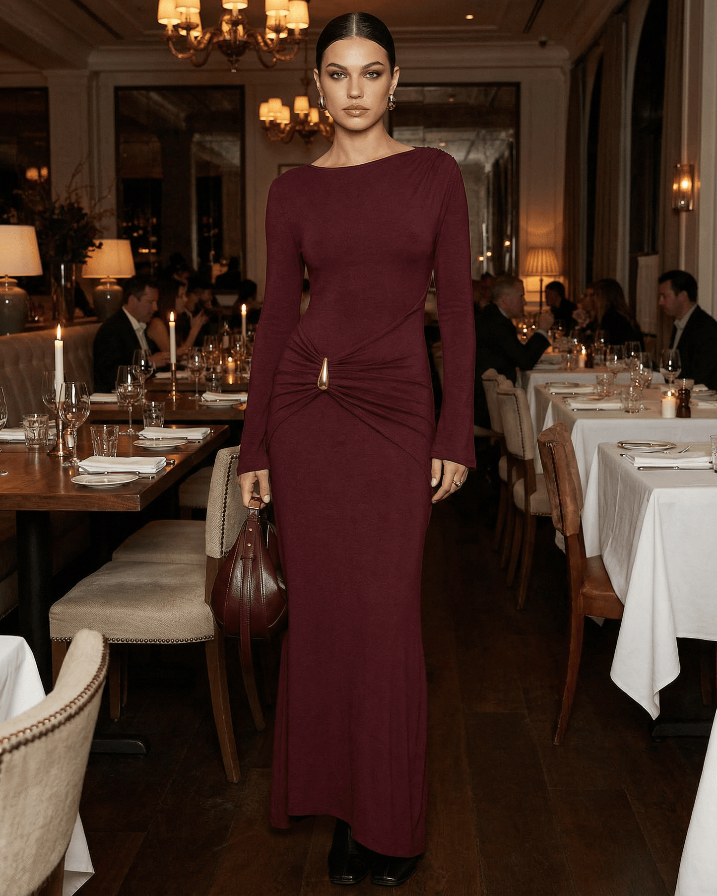 Elegant woman in Bordeaux Maxi Dress by Lauven at a candlelit restaurant table setting.