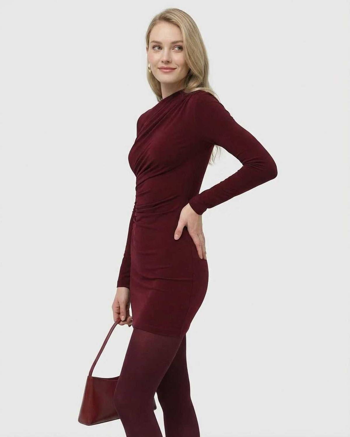 Model wearing Bordeaux Mini Dress by SLIMONA, showcasing a stylish long sleeve bodycon design in deep wine.