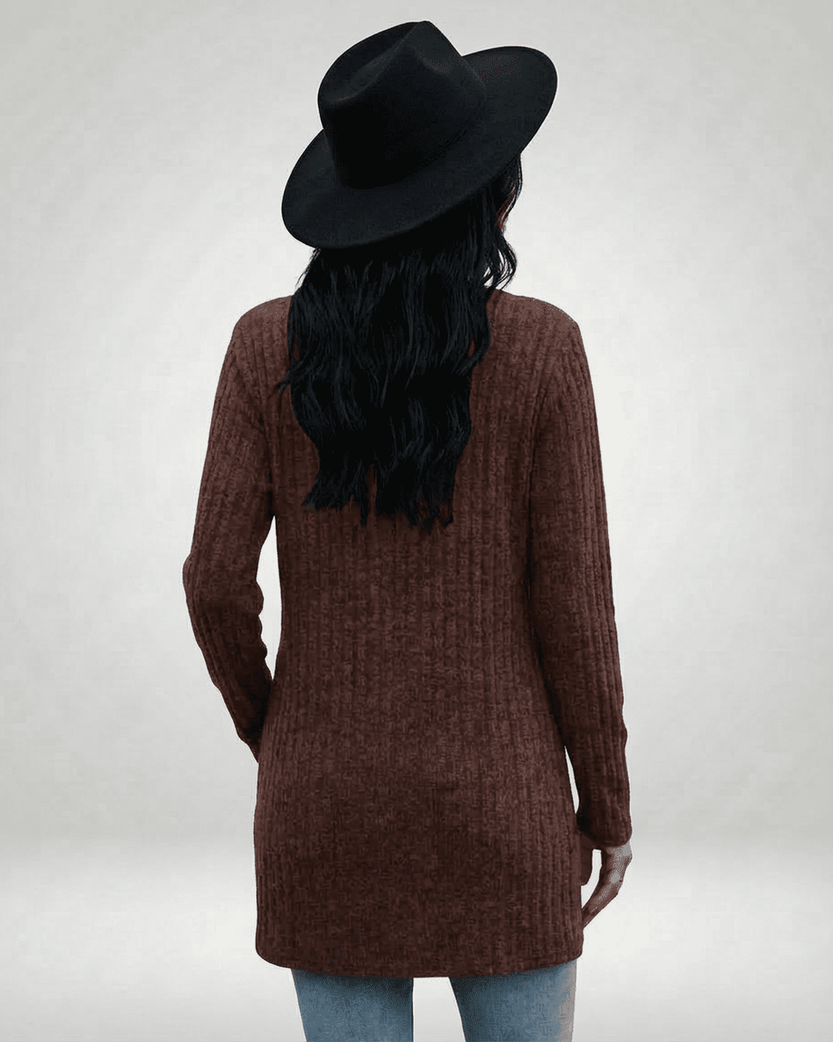 Cairo Cardigan by SLIMONA, showing a back view of a longline brown cardigan with textured knit and a stylish black hat.