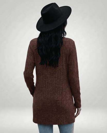 Cairo Cardigan by SLIMONA, showing a back view of a longline brown cardigan with textured knit and a stylish black hat.