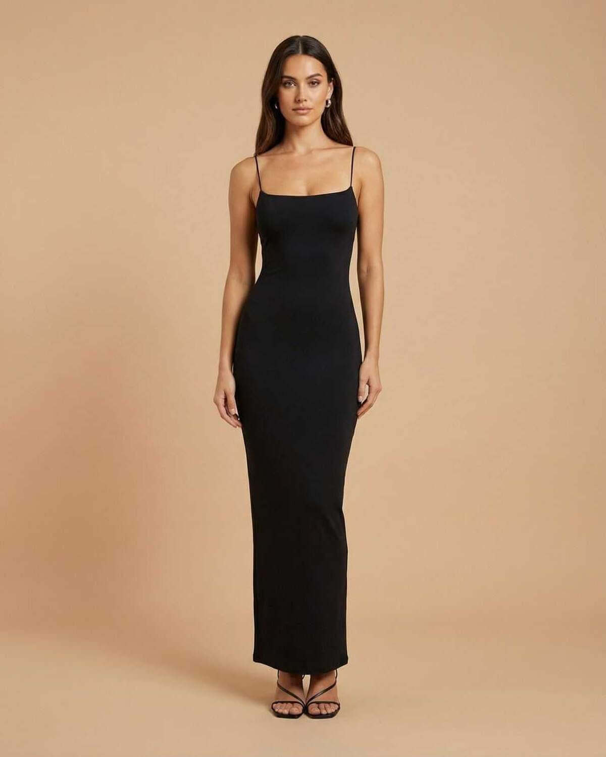 Calypso Maxi Dress by SLIMONA, a sleek black backless dress with spaghetti straps perfect for formal occasions.