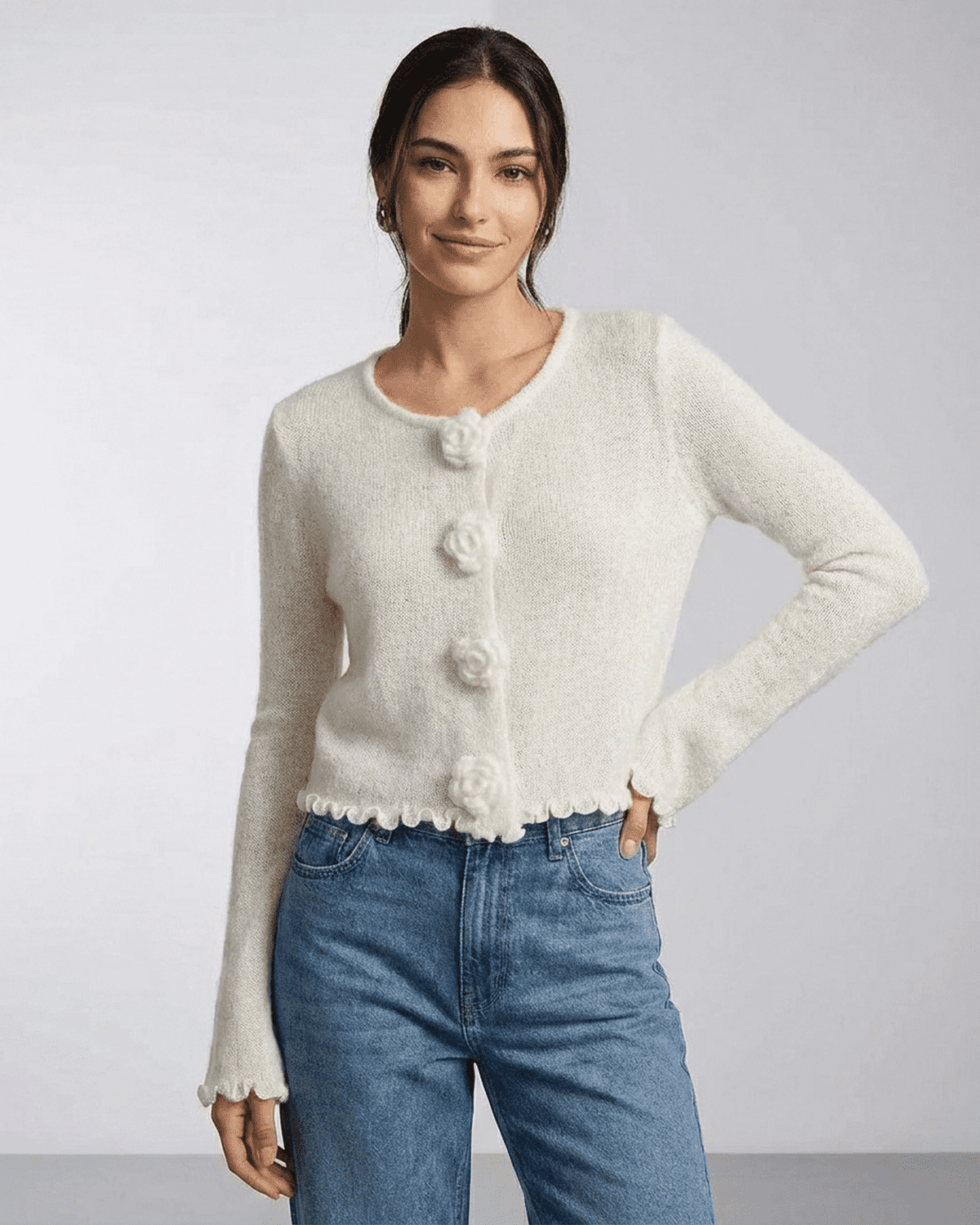 Camellia Cardigan by SLIMONA, featuring floral button detailing and a soft knit texture for an elegant casual look.