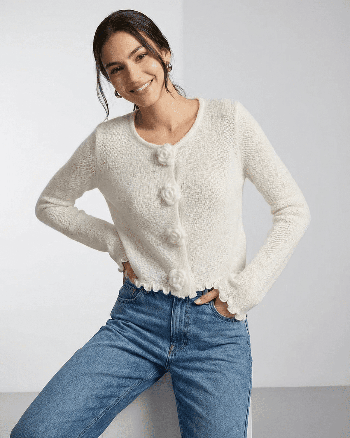 Camellia Cardigan by SLIMONA featuring floral button detailing and soft knit texture, ideal for modern styling.