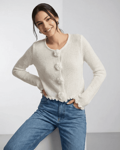 Camellia Cardigan by SLIMONA featuring floral button detailing and soft knit texture, ideal for modern styling.