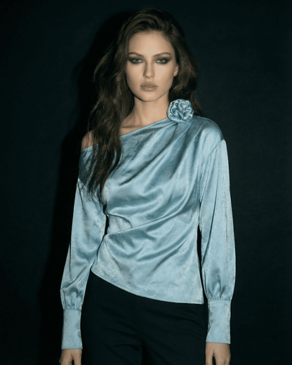 Celeste Blouse by SLIMONA, showcasing an asymmetrical satin-style design with a sculptural silhouette.