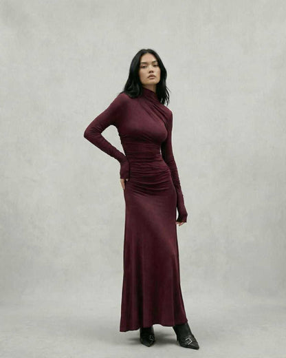 Elegant model wearing the Celeste Maxi Dress in burgundy, showcasing a sheath silhouette by Lauven.