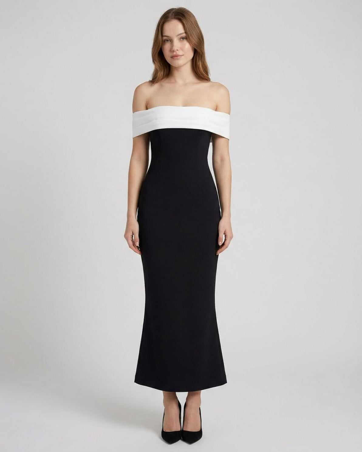 Celeste Maxi Dress by Lauven features an elegant off-shoulder silhouette in black and white, offering timeless sophistication.