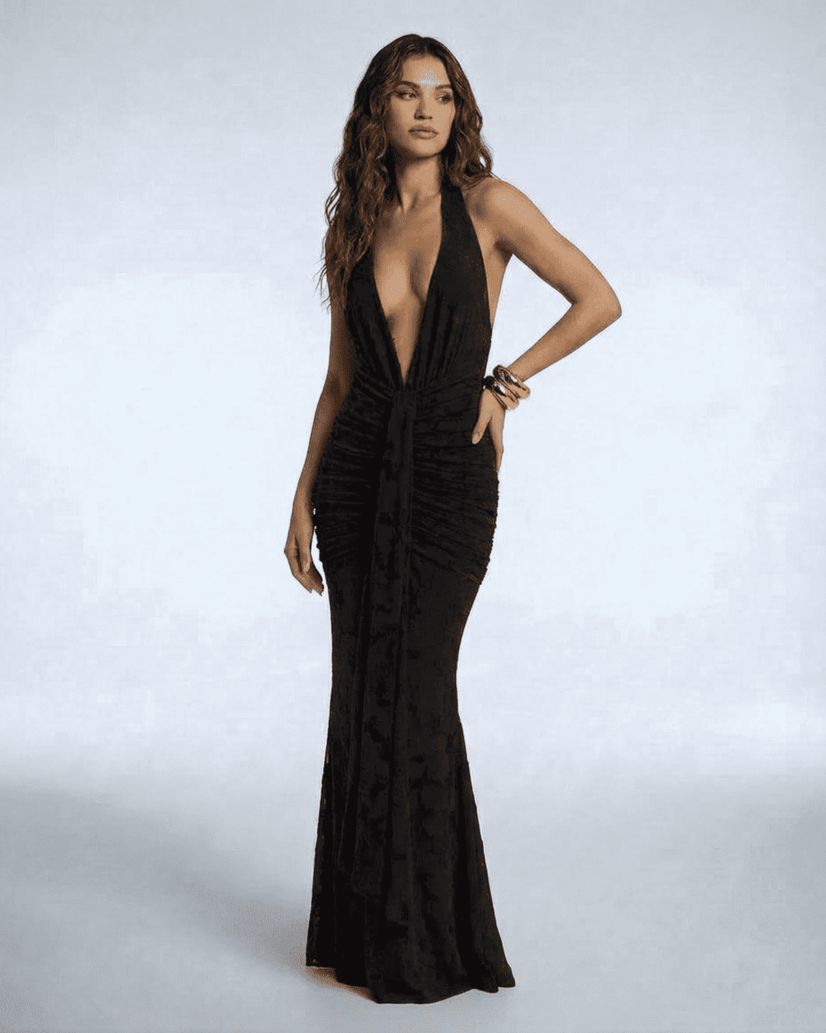 Celeste Maxi Dress by SLIMONA – Elegant black sleeveless gown with deep V-neckline and ruched silhouette.