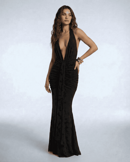 Celeste Maxi Dress by SLIMONA – Elegant black sleeveless gown with deep V-neckline and ruched silhouette.