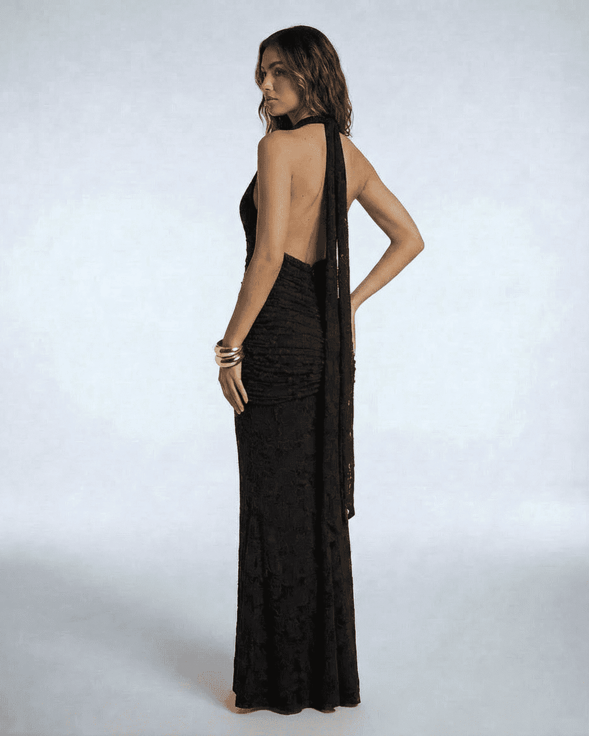 Celeste Maxi Dress by SLIMONA showcases a stunning back view with a sleek design and elegant tie-up ribbon detail.