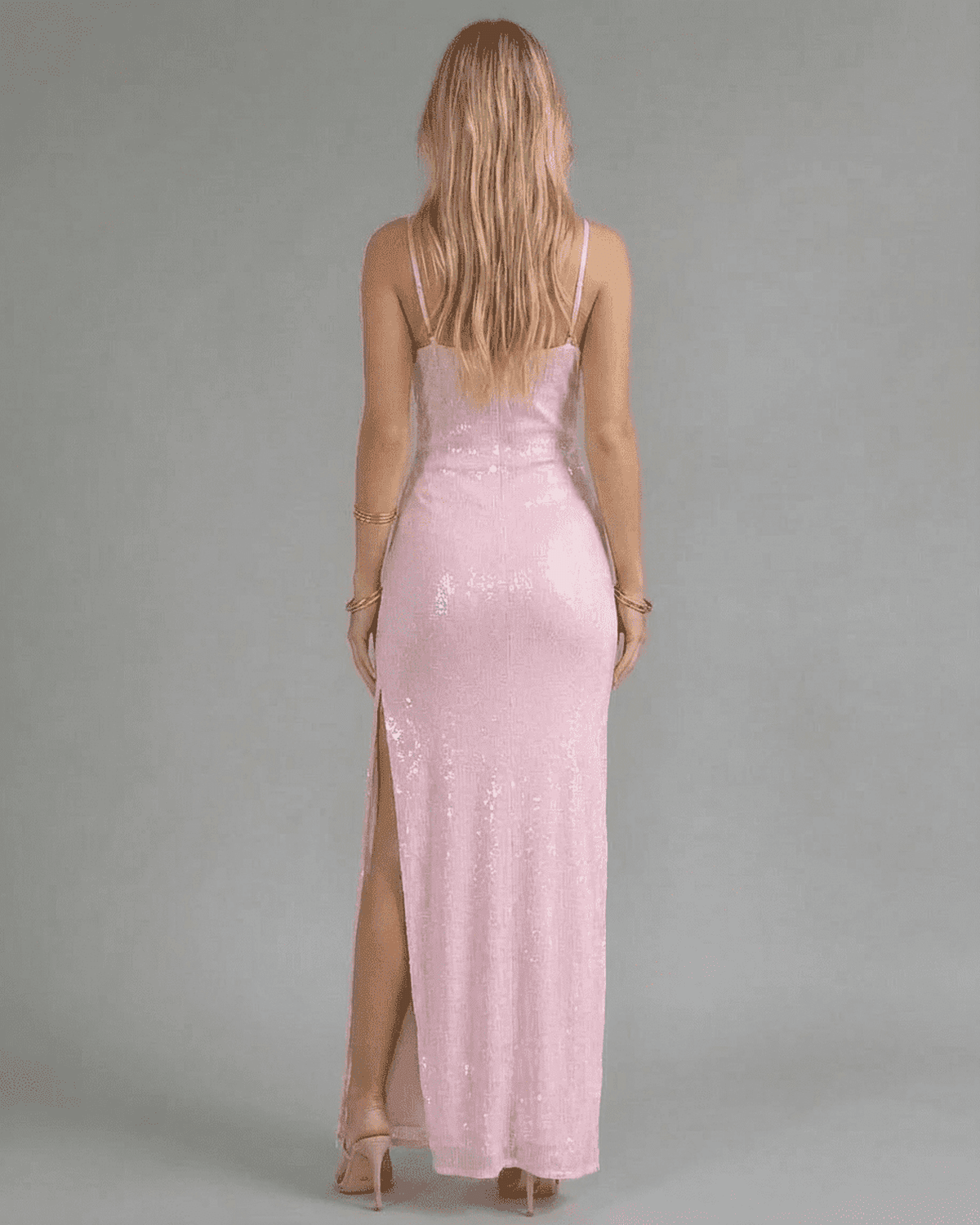 Celeste Maxi Dress by SLIMONA, showcasing the elegant back design in pink sequin with a high slit for a glamorous look.