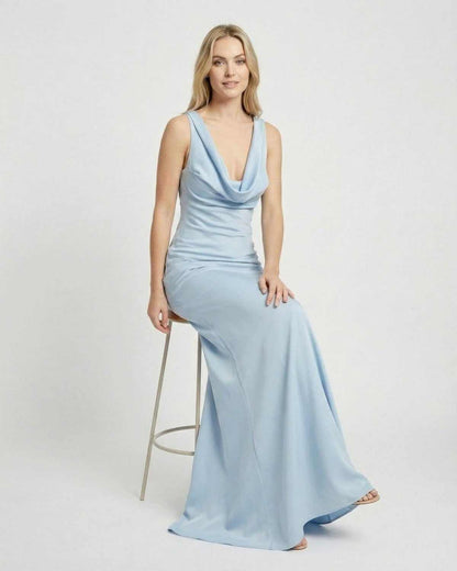Celeste Maxi Dress by SLIMONA, showcasing a satin-effect cowl neck design in a soft blue color.