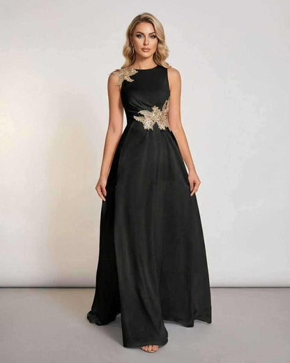 Celeste Maxi Dress by Lauven - Elegant sleeveless black maxi dress with patchwork detail and flowing silhouette.