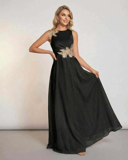 Elegant Lauven Celeste Maxi Dress featuring sleek sleeves and patchwork detail, showcasing a flowing silhouette.