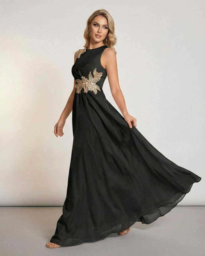 Celeste Maxi Dress by Lauven, elegant sleeveless black dress with patchwork detail and flowing silhouette.