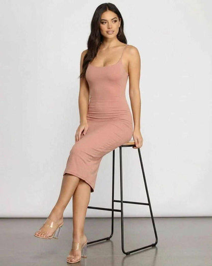 Celeste Midi Dress by SLIMONA, showcasing an elegant curve-hugging silhouette in soft knit fabric.