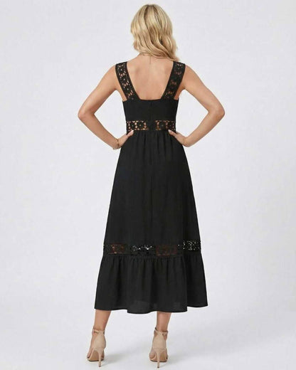 Back view of the Celeste Midi Dress by Lauven featuring elegant lace insets and a flowy hemline.