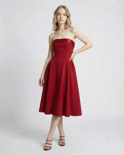 Celeste Midi Dress by SLIMONA, elegant strapless high-waist silhouette in red with pockets.