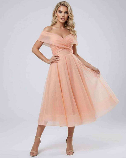 Celeste Midi Dress by Lauven in soft peach, showcasing an elegant off shoulder design perfect for special occasions.