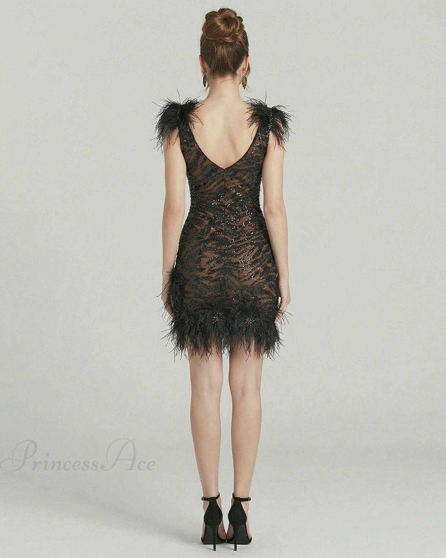 Celeste Mini Dress by Lauven, featuring feathered detailing and sequins, perfect for evening wear.