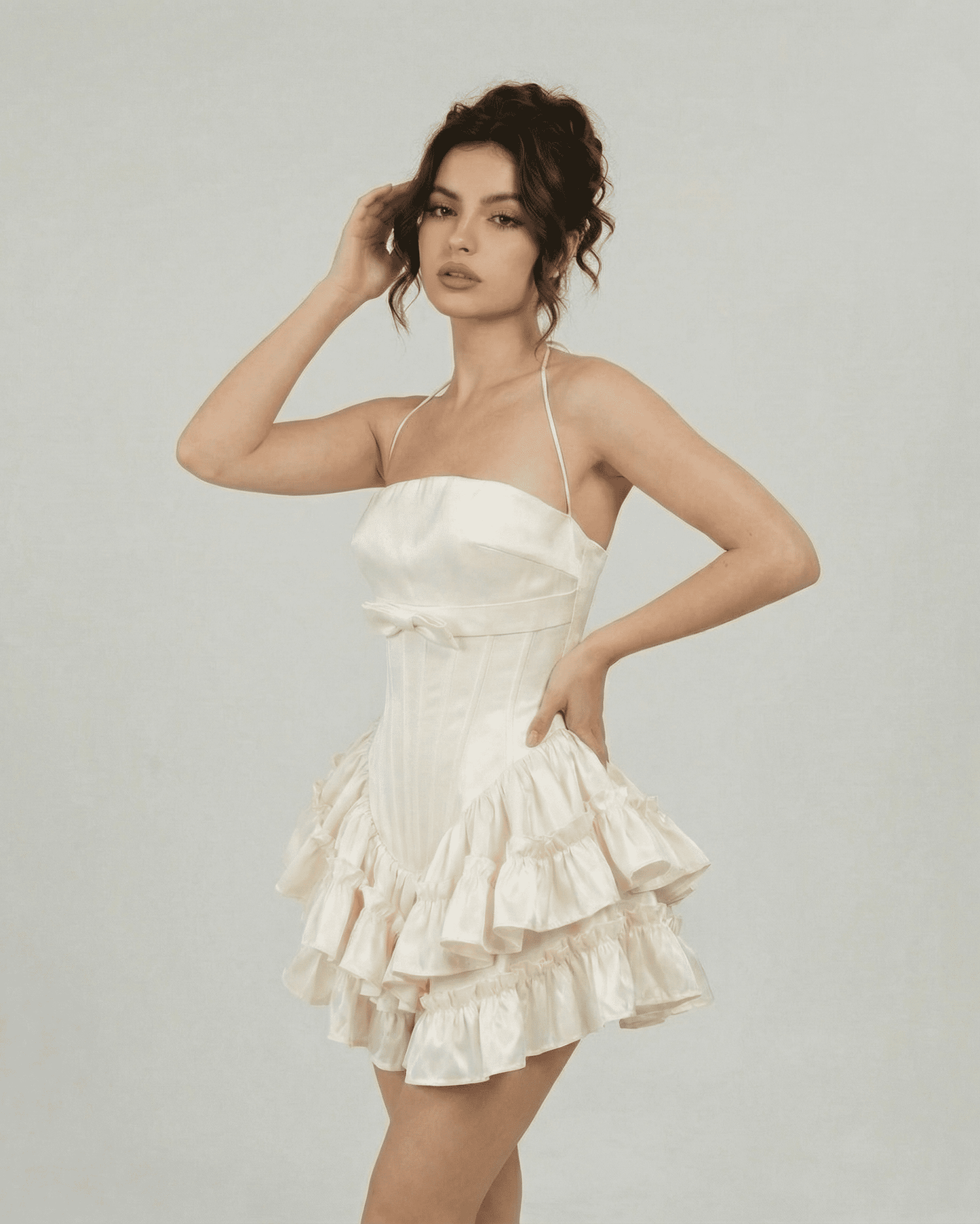 Celeste Mini Dress by SLIMONA - Elegant corset-inspired tiered mini dress in soft white fabric.