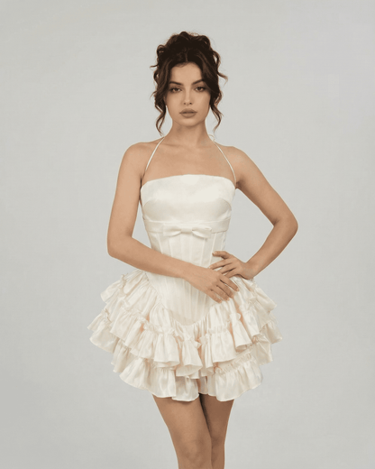 Celeste Mini Dress by SLIMONA - Corset-inspired tiered mini dress in soft white, showcasing a flattering silhouette.