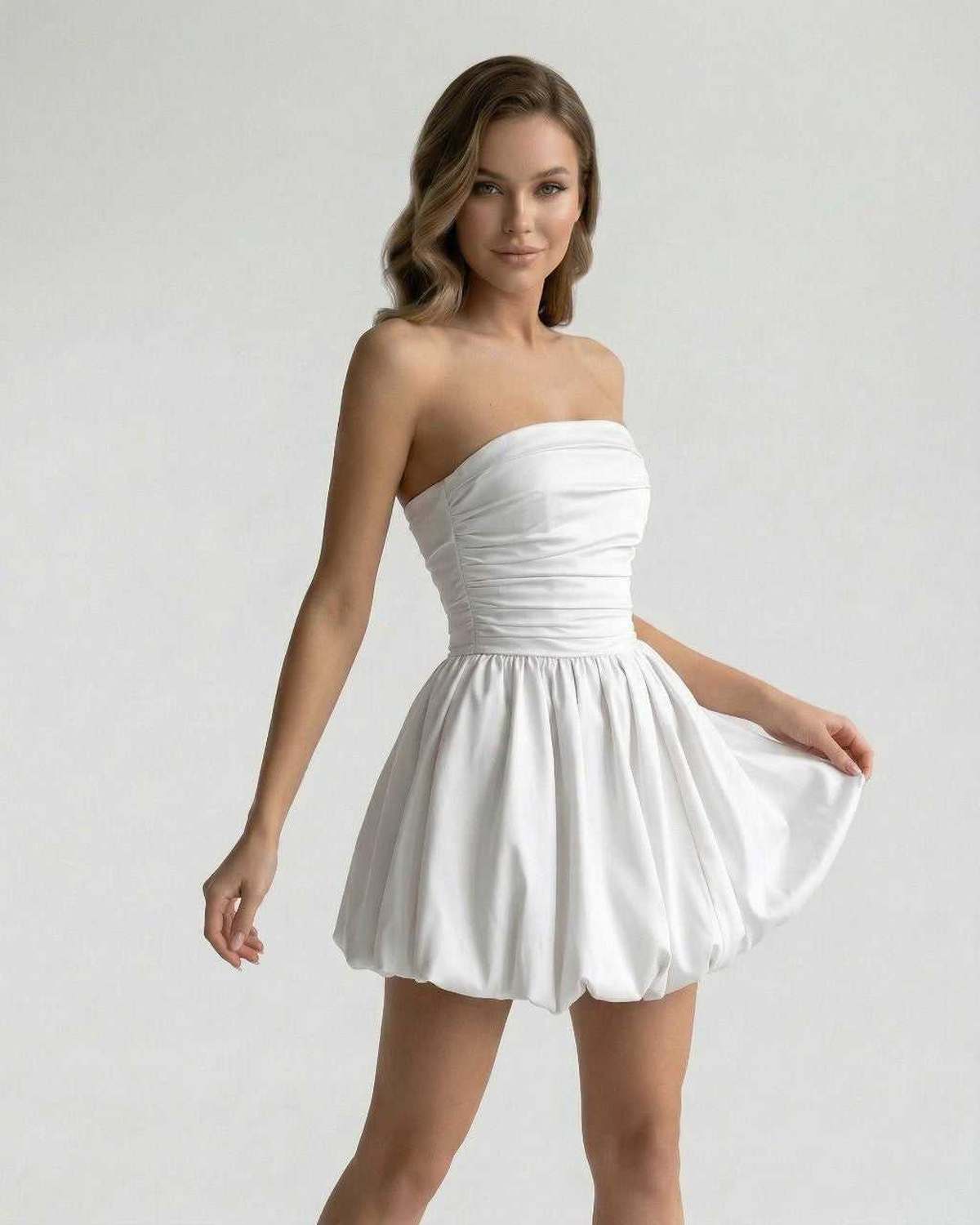 Celeste Mini Dress by Lauven – Elegant strapless white satin A-line mini dress with a playful bubble silhouette.