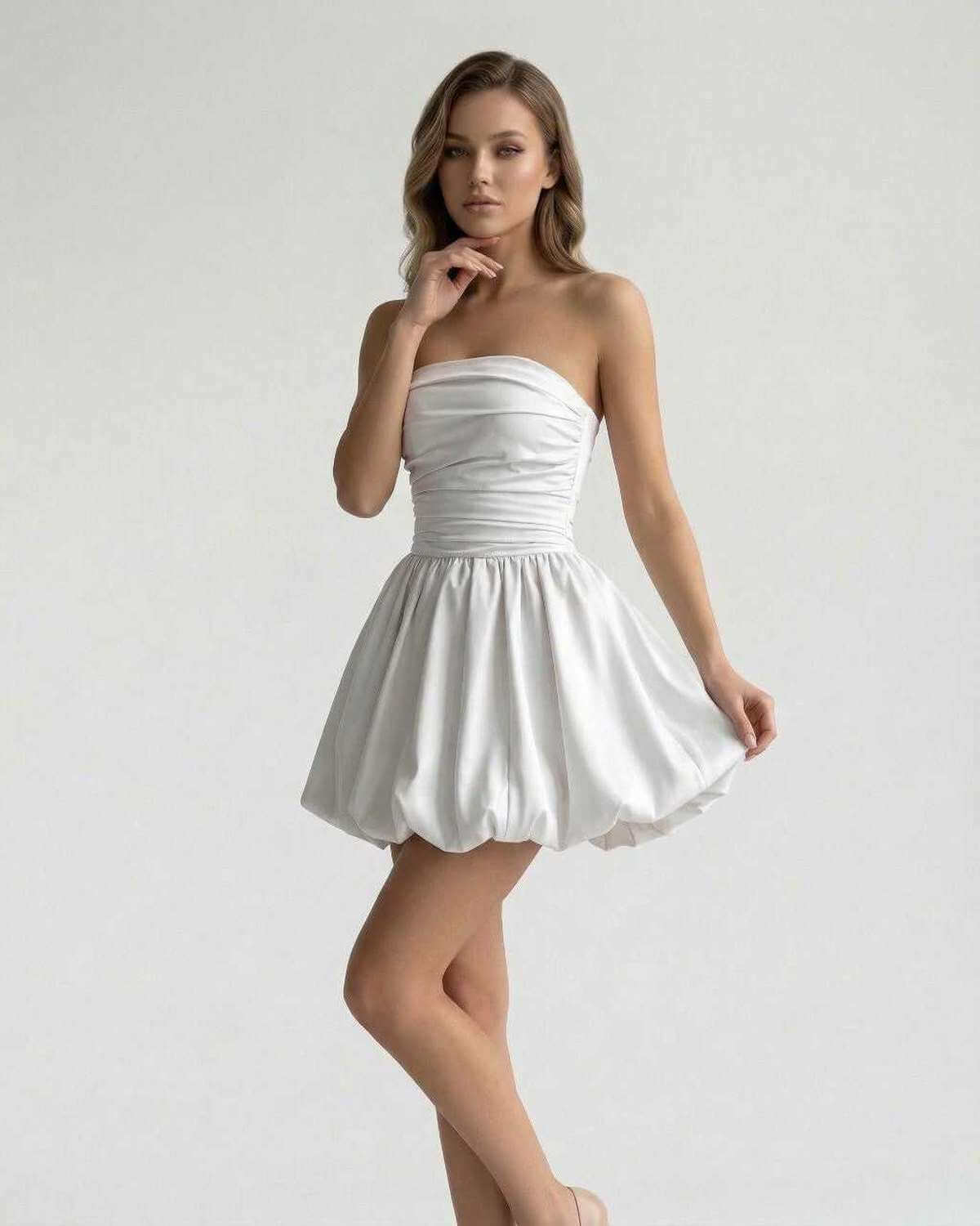 Celeste Mini Dress by Lauven – Elegant strapless white satin A-line mini dress with ruched bodice and bubble skirt.