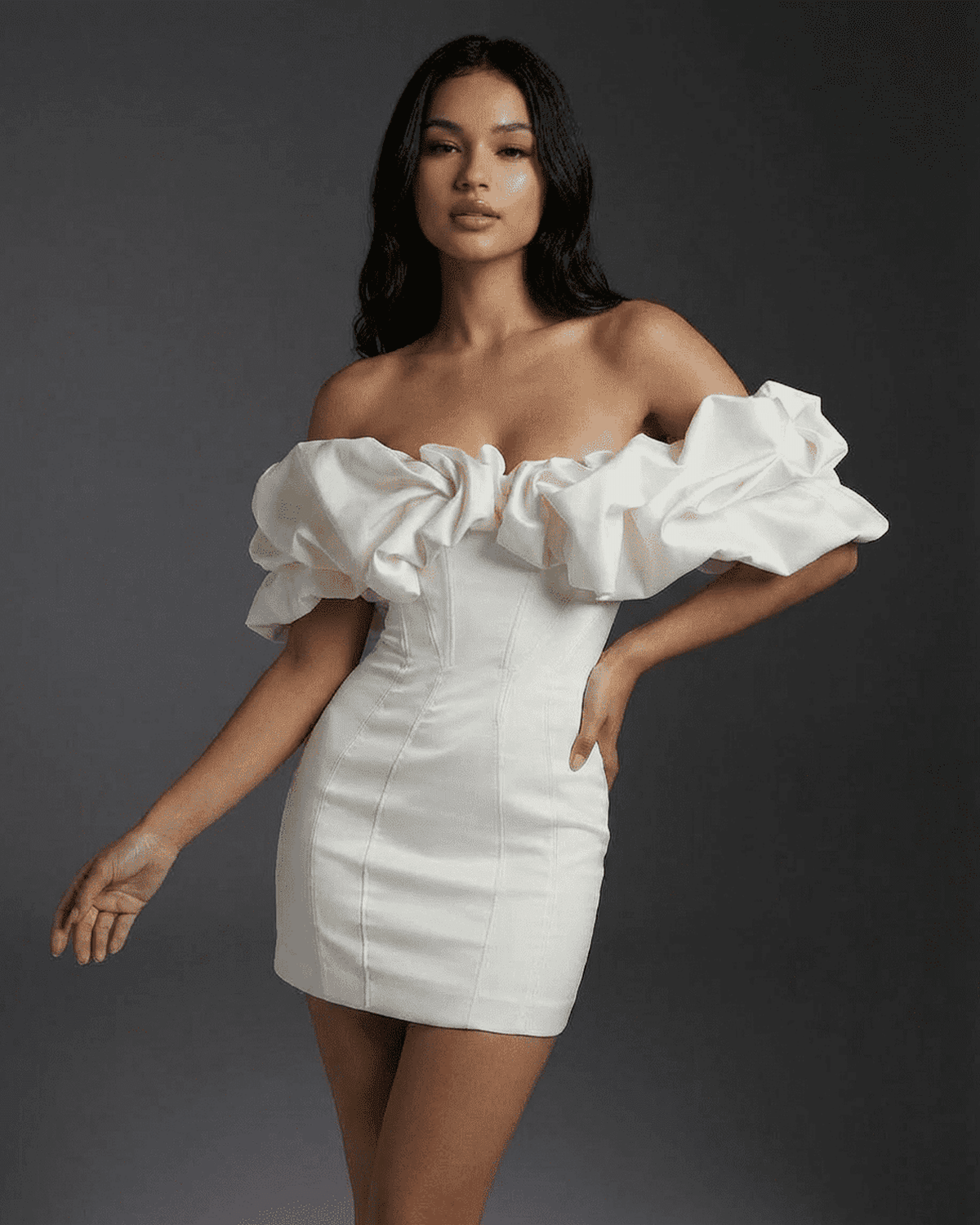 Celeste Mini Dress by SLIMONA featuring off-the-shoulder design and dramatic ruffle trim for a stunning silhouette.
