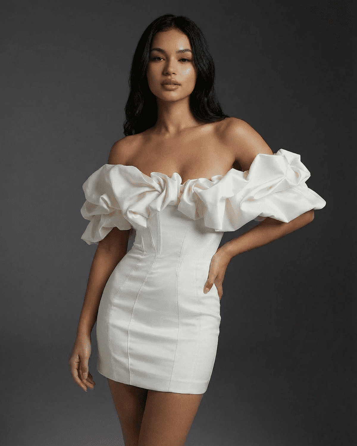 Celeste Mini Dress by SLIMONA, showcasing a bodycon fit with boned structure and ruffle trim for a stylish look.