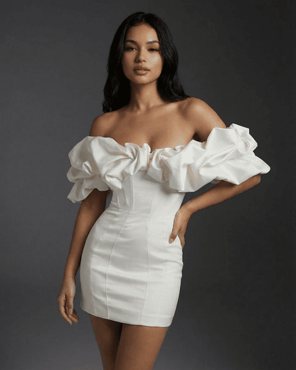 Celeste Mini Dress by SLIMONA, showcasing a bodycon fit with boned structure and ruffle trim for a stylish look.